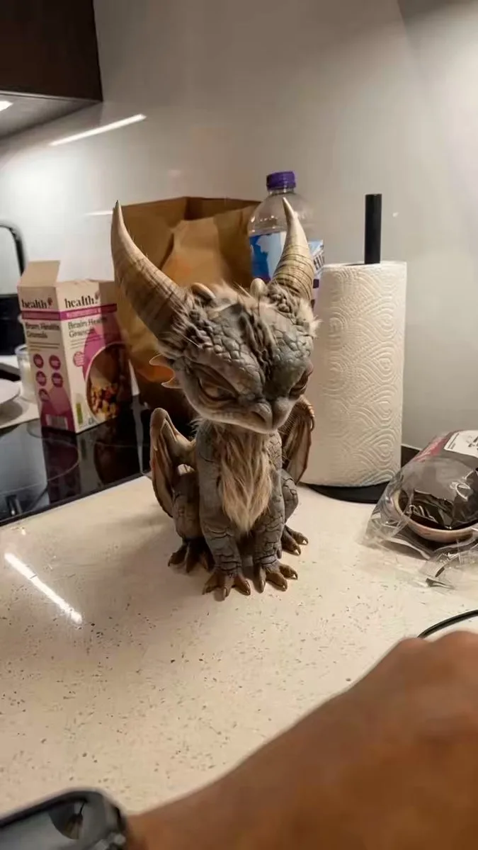 A real hand offers a real grape and an AI dragon reacts, made with Simulon